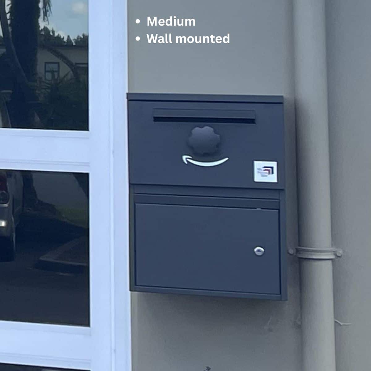 A medium parcel box in Charcoal wall-mounted.