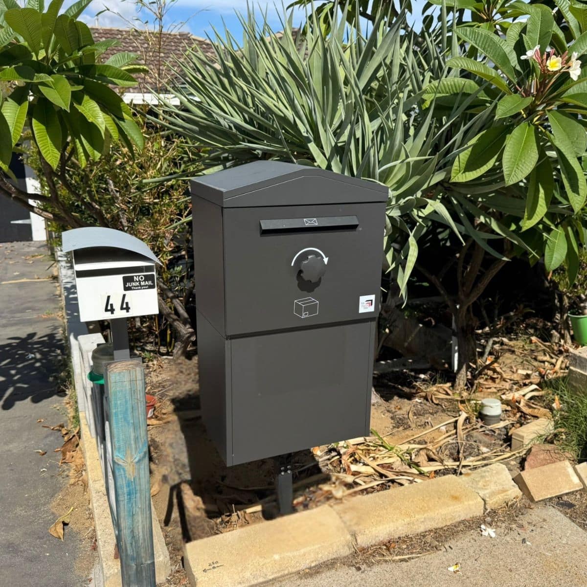A large parcel box in Charcoal installed at a home